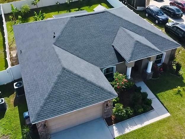 The same house from the air with its new architectural shingle roof, finished and clean